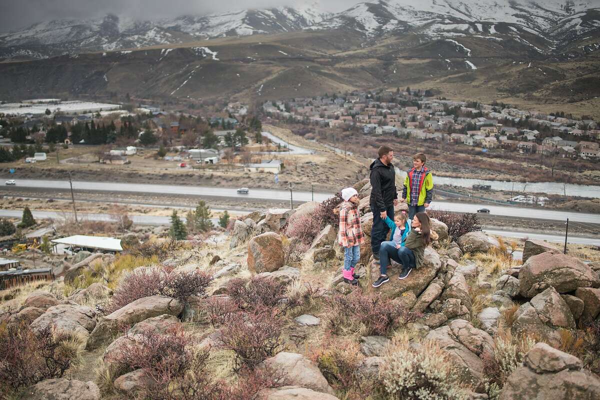 Bryan Allegretto walks with his family to the top of a hill that he owns in Reno, Nevada on Sunday March 3rd, 2019