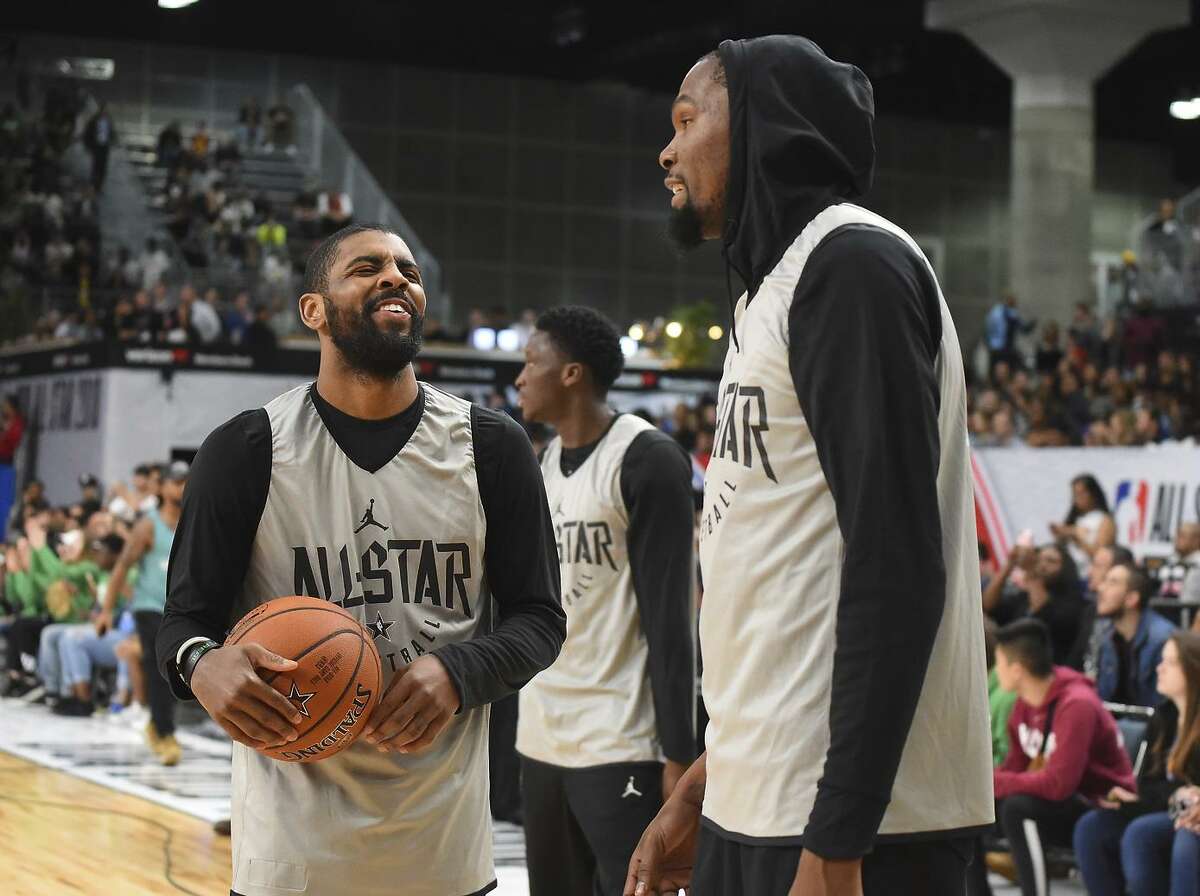 Kyrie Irving #11 and Kevin Durant #25 of Team LaBron laugh during practice for the 2018 NBA All-Star game at the Verizon Up Arena at LACC on February 17, 2018 in Los Angeles, California. NOTE TO USER: User expressly acknowledges and agrees that, by downloading and or using this photograph, User is consenting to the terms and conditions of the Getty Images License Agreement.