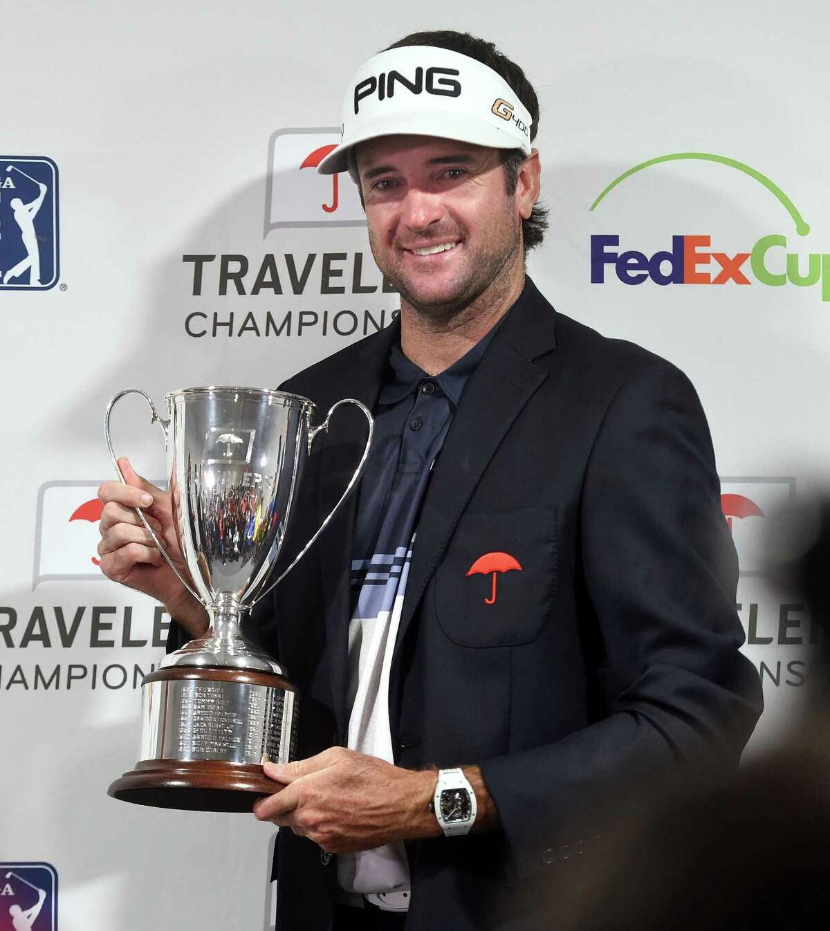 Bubba Watson holds the trophy after winning the Travelers Championship in 2018.