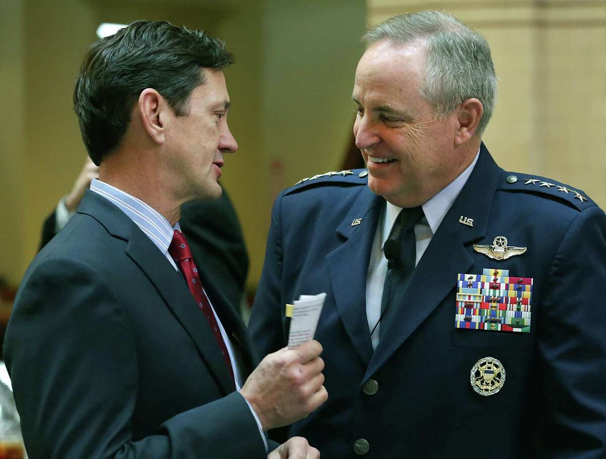 Wayne Peacock, left, a longtime USAA executive, will become its CEO and president effective Feb. 1. In this 2015 photo, Peacock speaks with Gen. Mark A. Welsh III, chief of staff of the U.S. Air Force, at a San Antonio Chamber of Commerce luncheon.