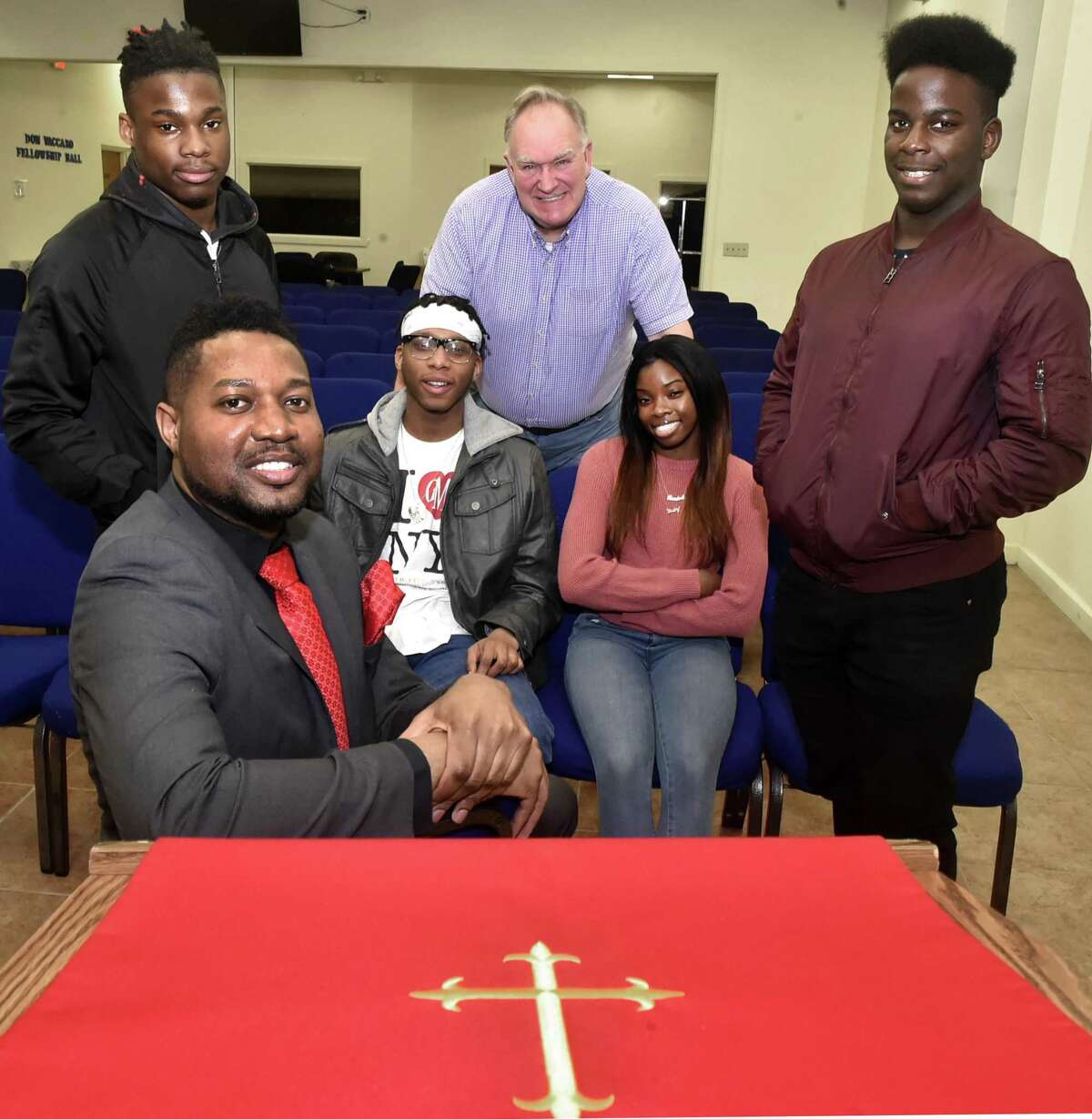 The Rev. Herron Gaston, associate director of admissions and recruitment at Yale Divinity School and senior pastor at Summerfield United Methodist Church in Bridgeport, sitting front, organized Youth with a Purpose, whose members include Kayno Williams, 18, of Bridgeport, standing left, Percy Smith, 19, of New Haven, sitting left, Randene Harris, 17, of New Haven, sitting right, and Thomas James, 19, of New Haven, standing right, and Richard Marquette, center, a New Haven attorney and Yale Divinity School graduate.