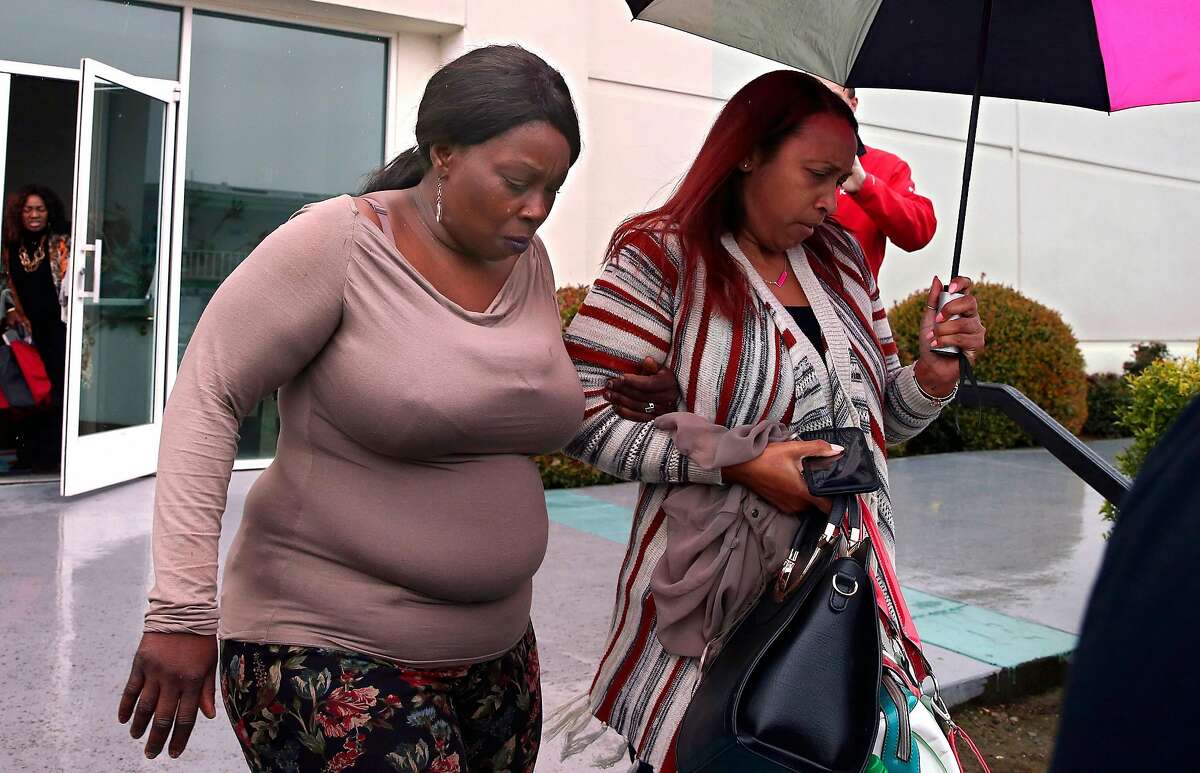 SeQuette Clark, left, leaves the Calvary Christian Center after meeting with California Attorney General Xavier Becerra Tuesday, March 5, 2019, in Sacramento, Calif. Becerra is expected later today to announce the results of his criminal investigation into the shooting death of Clark's son, Stephon Clark, by Sacramento police officers last year. (AP Photo/Rich Pedroncelli)