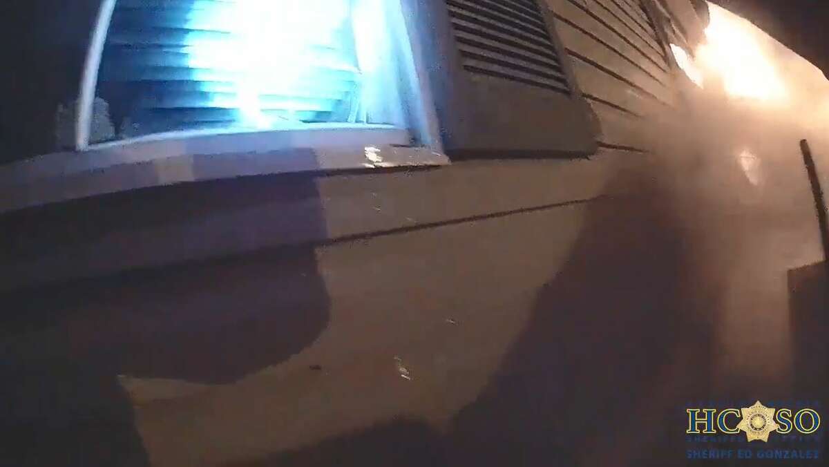 Harris County Sheriff's Deputy Roberto Martinez saved a woman from a burning trailer home in Baytown on Monday night. Images here are taken from the officer's bodycam.