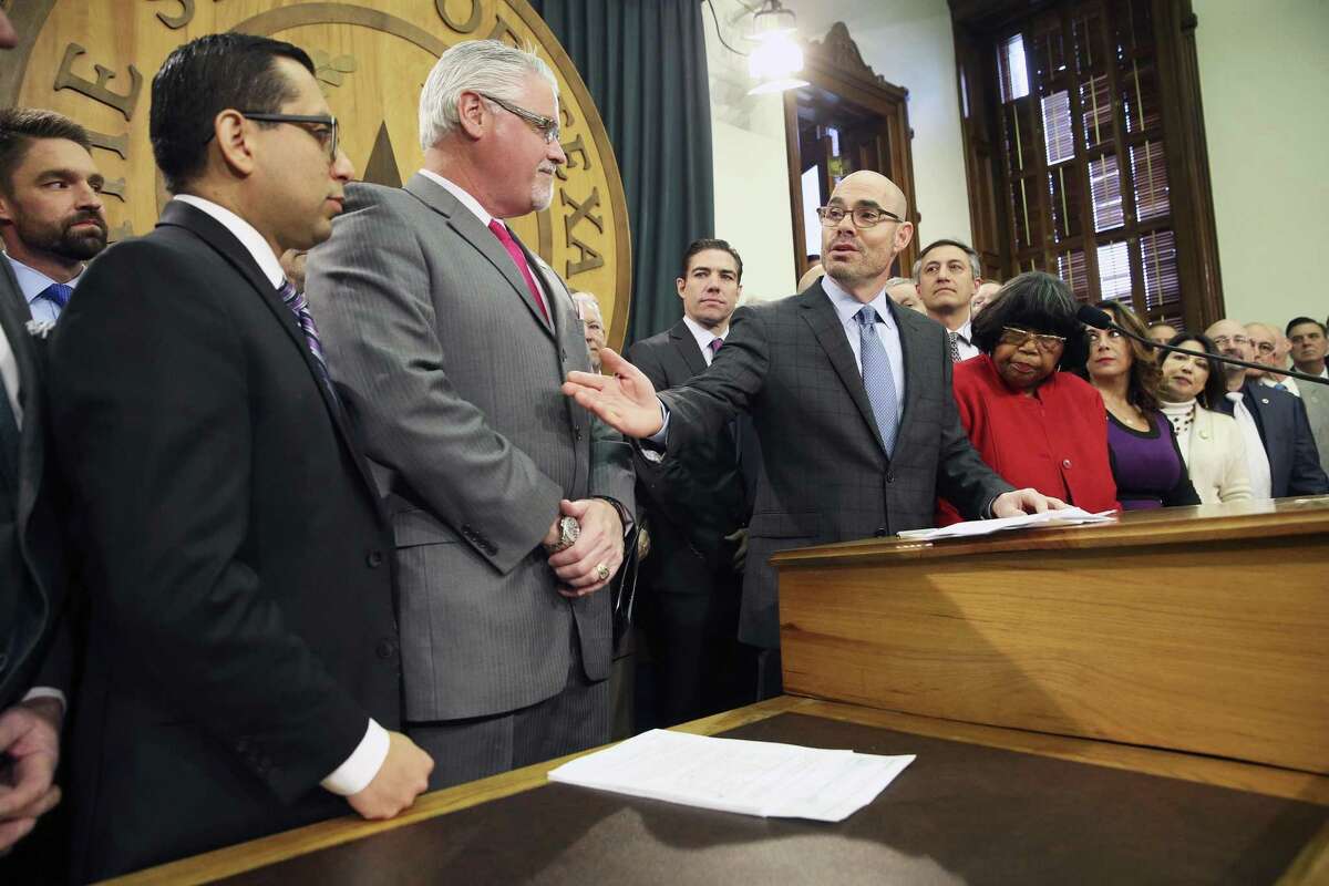 Speaker Dennis Bonnen, R-Angleton, introduces Rep. Diego Bernal, left, and Rep. Dan Huberty as the House Education bill is unveiled in the Speaker's Commmittee Room at the Capitol on March 5, 2019. Both Bonnen and Huberty have spoken publicly this year about their struggles with dyslexia.