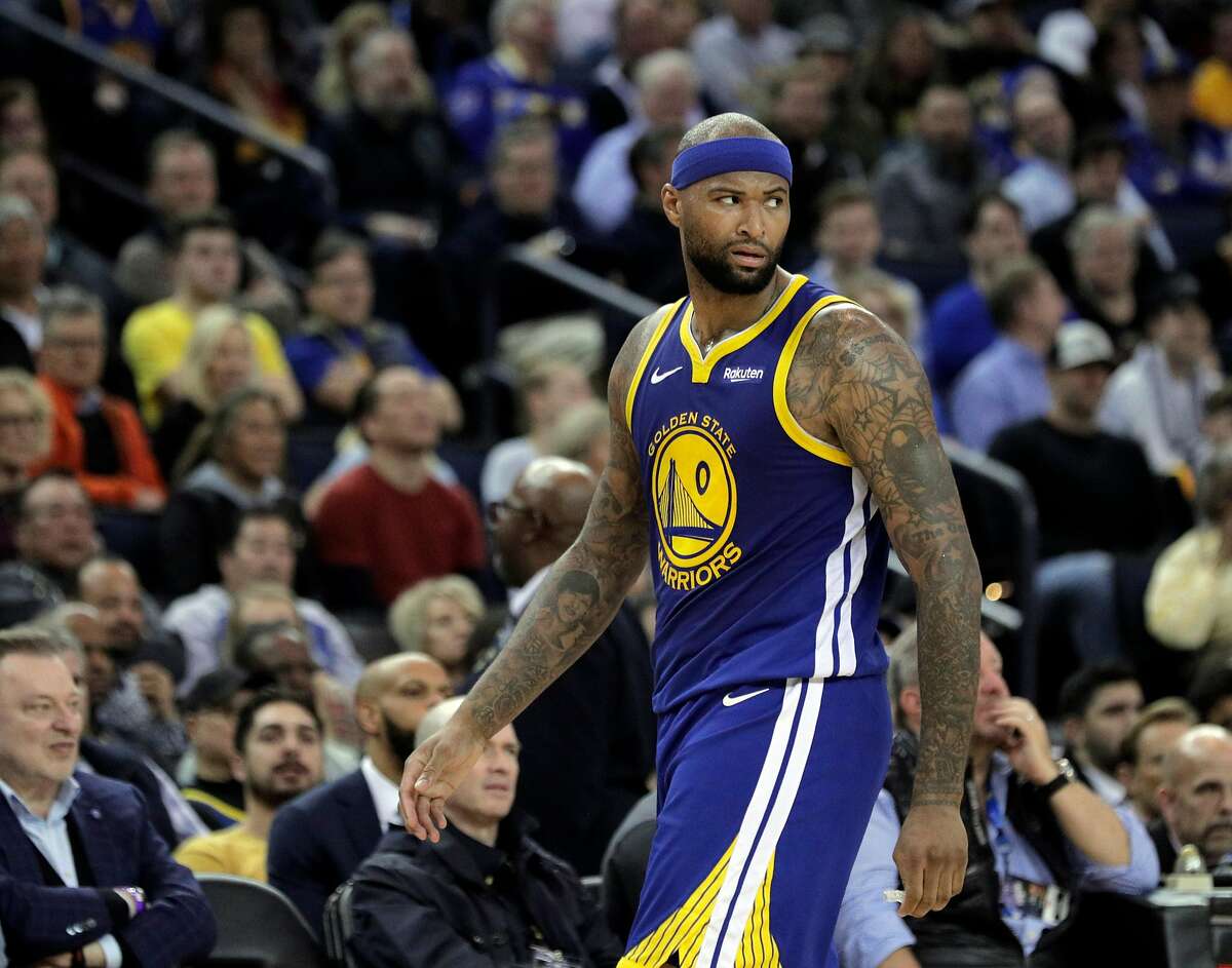 DeMarcus Cousins (0) walks back to the bench after a scuffle late in the second half as the Golden State Warriors played the Boston Celtics at Oracle Arena in Oakland, Calif., on Tuesday, March 5, 2019.