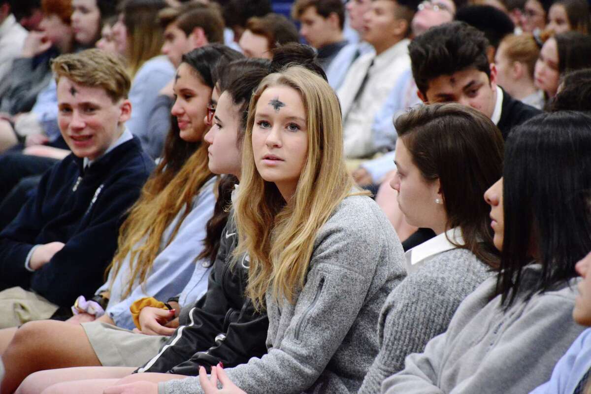 Immaculate High school students received ashes on their forehead during the schools Ash Wednesday service that marks the beginning of Lent for the Catholic religion. Wednesday March 6, 2019.