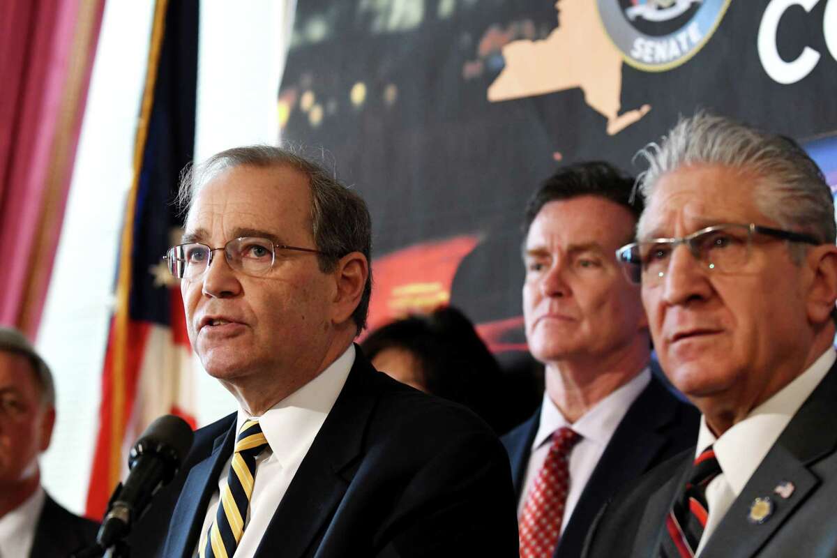 Schenectady County District Attorney Robert Carney, left, is joined by Senate Republican Leader John Flanagan, center, and Sen. James Tedisco, right, during a press conference where they addressed the downside of proposed criminal justice reform measures on Wednesday, March 6, 2019, at the Capitol in Albany, N.Y. (Will Waldron/Times Union)