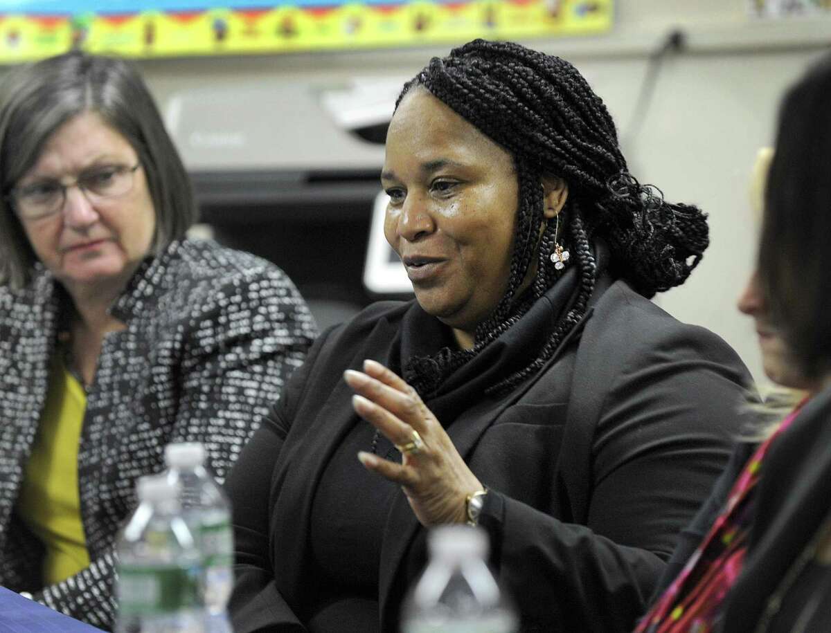 Marlene Moore-Callands abruptly retired from Danbury City Hall in September after a dispute with her bosses in the city's permitting department over what she claims was a hostile work environment following a 2017 confrontation about professional football players kneeling during the national anthem.