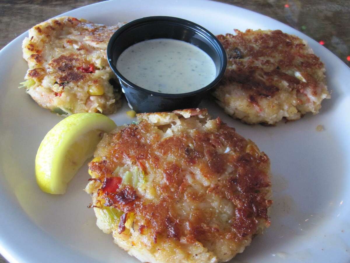 Sam's Boat Gulf Coast Kitchen + Sports Bar at 1827 N. Loop 1604 E. has closed, according to a sign posted at the restaurant. Crabcakes like these from the Sam’s Boat in Clear Lake were part of the extensive seafood menu.