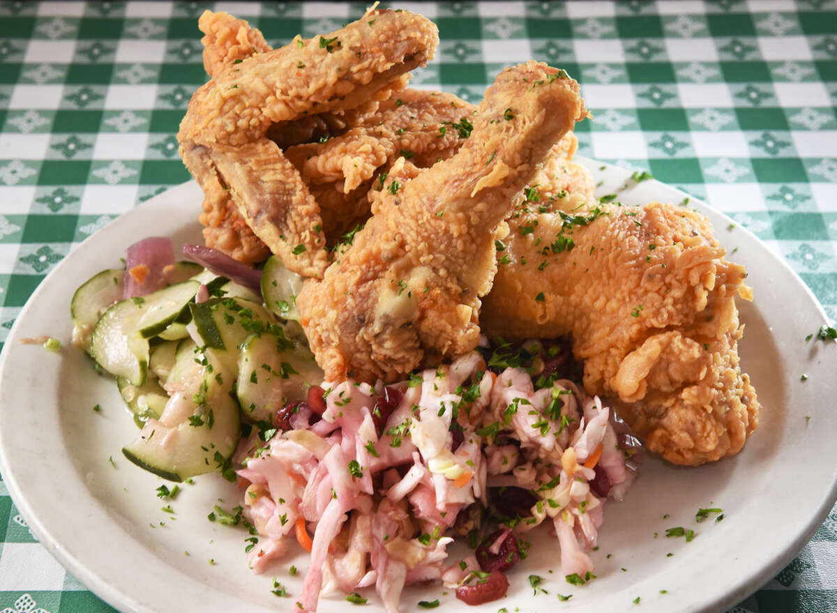 Fried chicken with cucumber salad and cranberry coleslaw at Hattie's Restaurant on Phila Street Wednesday June 6, 2018 in Saratoga Springs, NY. (John Carl D'Annibale/Times Union)