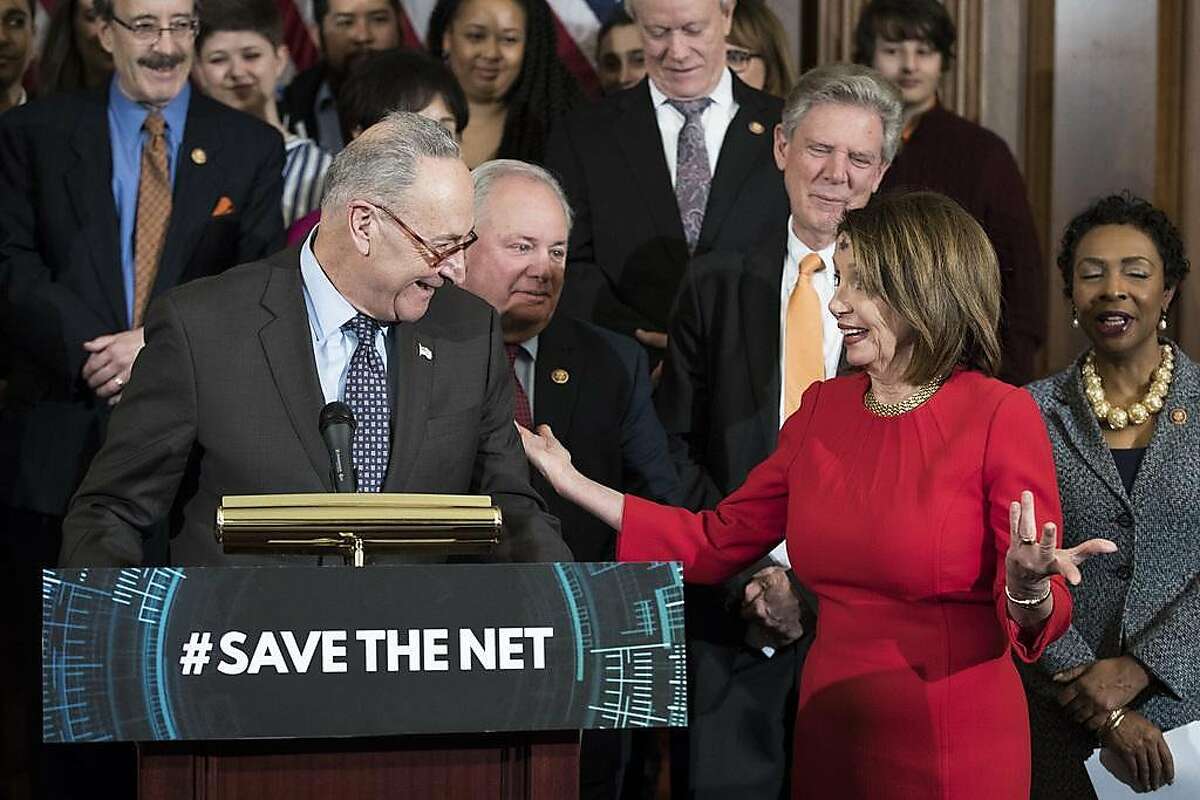 Senate Minority Leader Chuck Schumer (D-N.Y.) and House Speaker Nancy Pelosi (D-Calif.) participate in a news conference on net neutrality in the Rayburn Room of the U.S. Capitol, in Washington, March 6, 2019. (Sarah Silbiger/The New York Times)