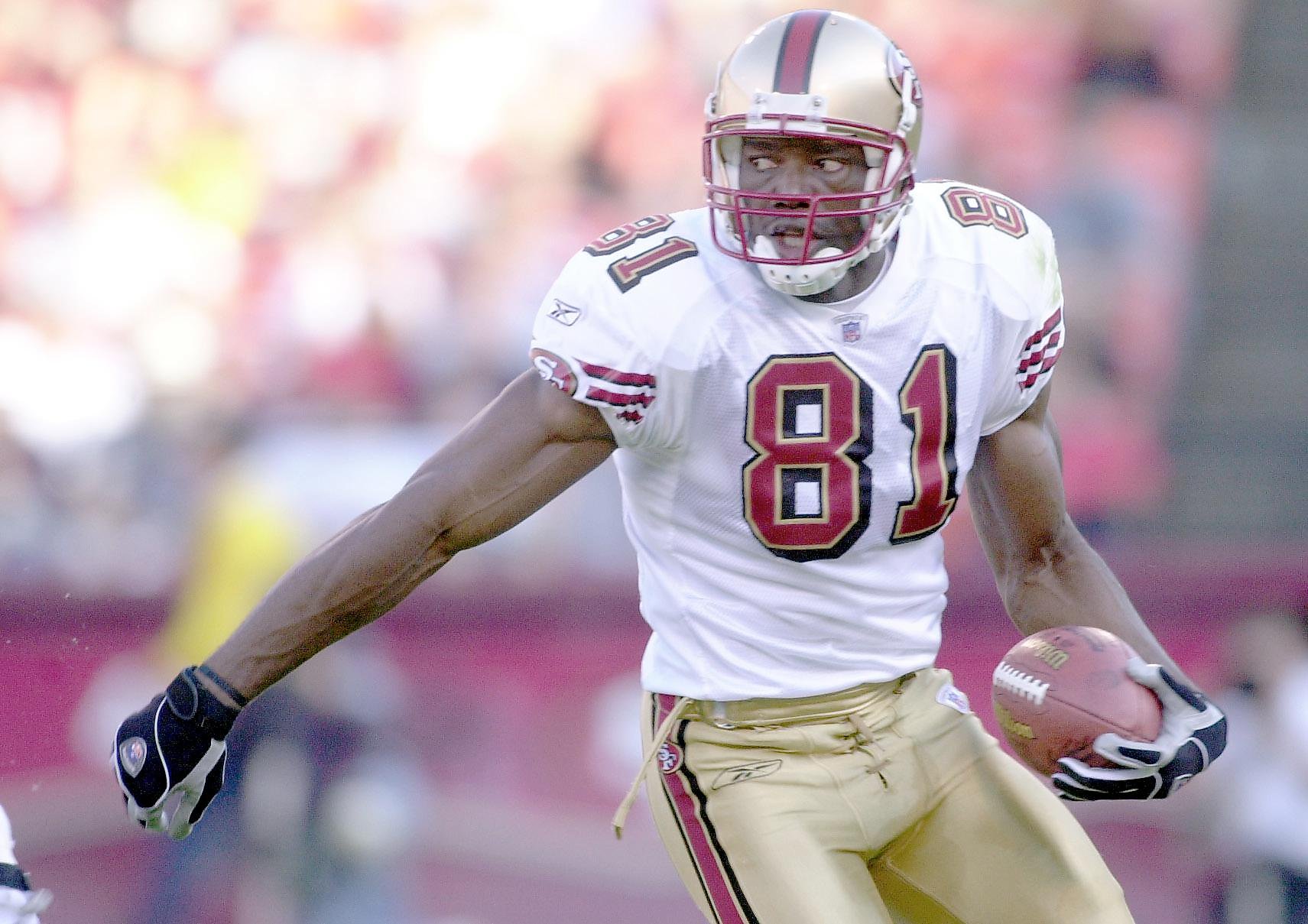 San Francisco 49ers Terrell Owens (81) jokes with the fans after