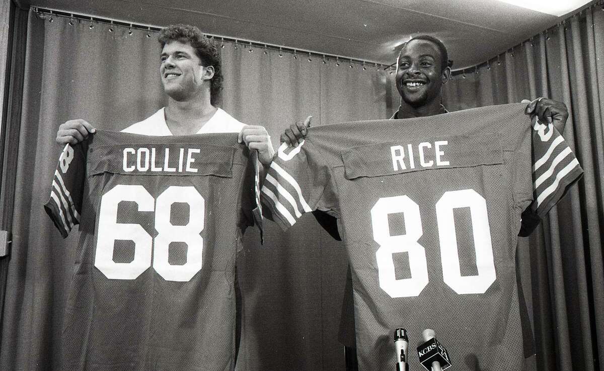 May 1, 1985: Jerry Rice poses with his jersey, after being announced as the 49ers first round draft pick in 1985. Bruce Collie is alongside.