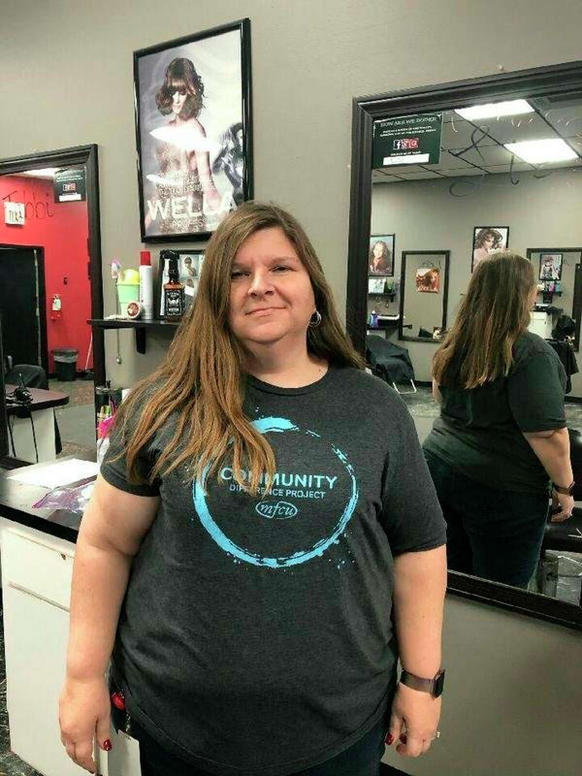 Members First Credit Union employee Melanie Duke before her head is shaved. (Photo provided)