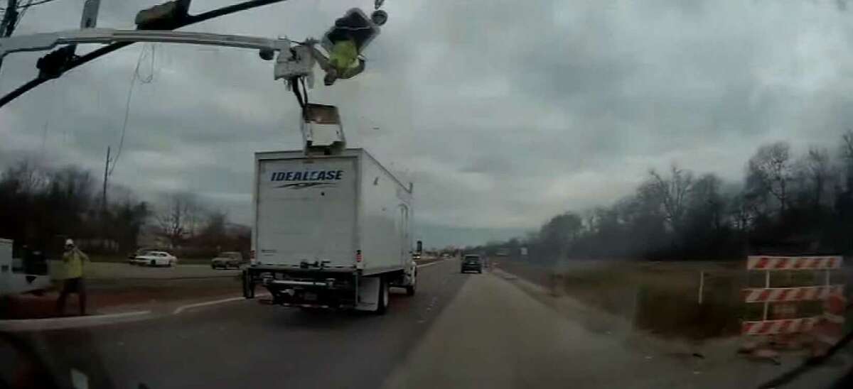Shocking video shows moment truck clips utility worker in bucket above ...