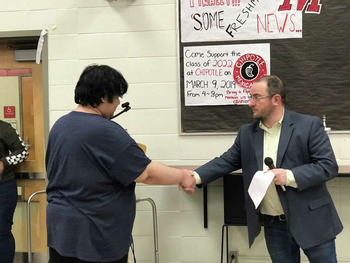 Zachary Tanenbaum shakes hands with Alexander Lumelsky, Tournaments Coordinator at the Connecticut State Chess Association, after winning his third consecutive Connecticut State Chess Association tournament over the weekend.