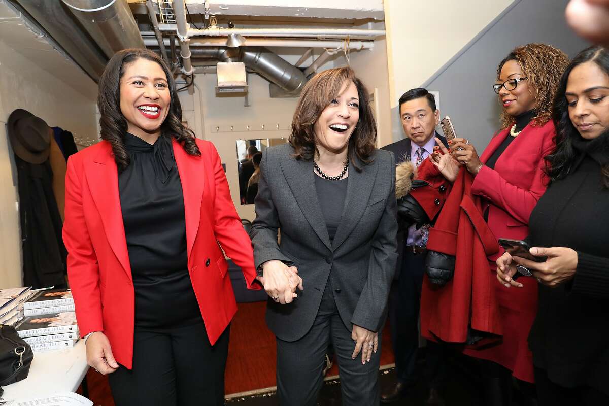 Senator Kamala Harris (right) holds hands with San Francisco Mayor London Breed at the Curran in San Francisco, Calif., on Saturday, January 12, 2019. Harris spoke on stage about her new memoir.