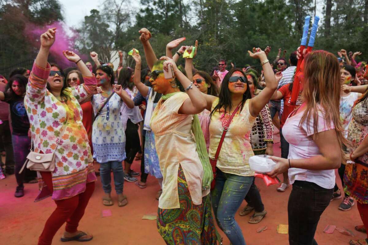 Attendees dance during the annual Holi festival on Saturday, March 3, 2018, at the Hindu Temple of The Woodlands. This year’s event at the temple along South Forestgate Drive is scheduled from noon to 4 p.m. March 16.