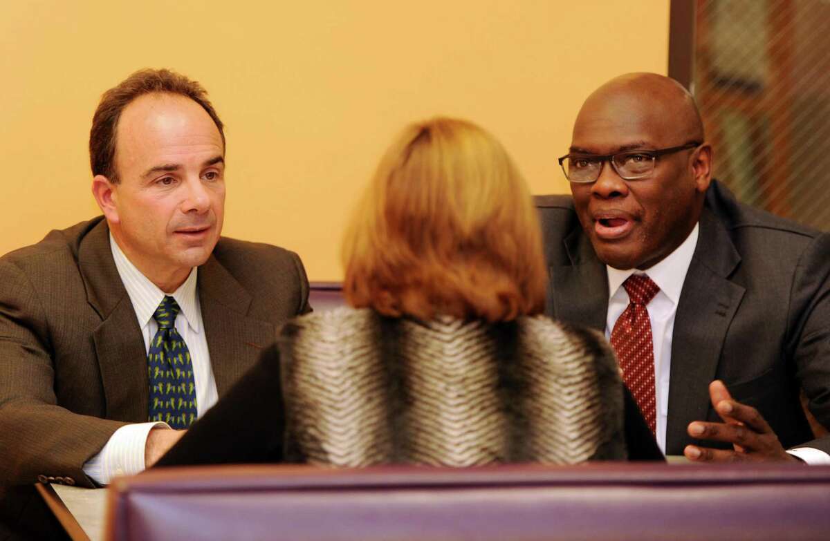 Bridgeport Mayor-elect Joseph Ganim meets with State Rep. Charlie Stallworth and outgoing Town Clerk Alma Maya in 2015.