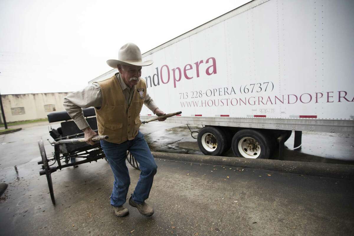 Glenn Moreland pulls a light wagon to the Houston Grand Opera storage area on Tuesday, Feb. 26, 2019, in Houston. The wagon will be used as a prop for a HGO's new opera called "The Phoenix."