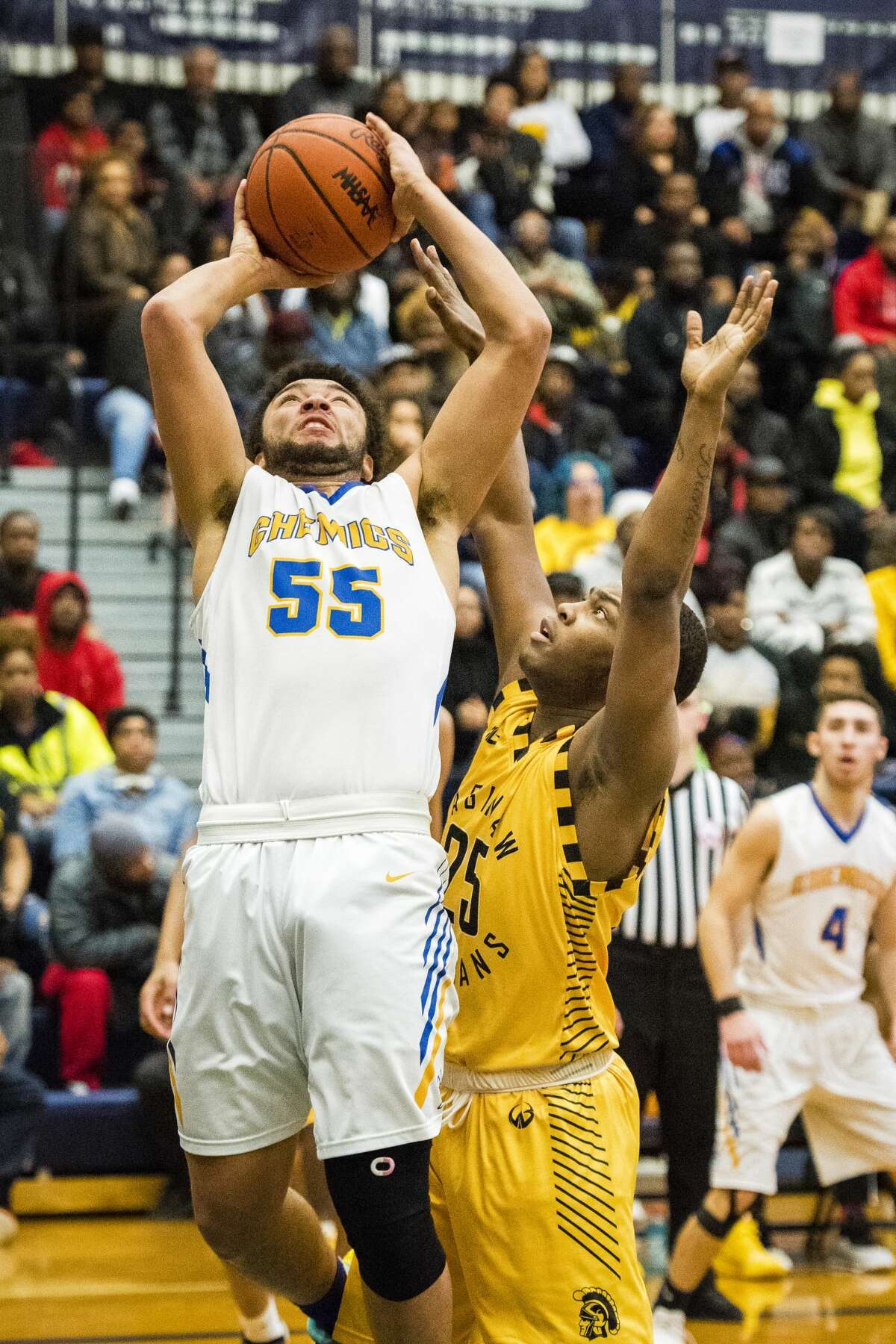 Midland senior Isaiah Bridges takes a shot during the Division 1 regional final on Friday in Saginaw. (Danielle McGrew Tenbusch/for the Daily News)