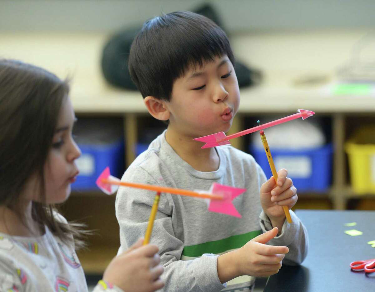 Kindergartner Nico Chan tests out his homemade weather vane during a visit from the Talcott Mountain Science Center at Old Greenwich School in Old Greenwich, Conn. Wednesday, Feb. 20, 2019. The school recently installed a fully equipped weather station that gives accurate temperature, wind and barometric readings.