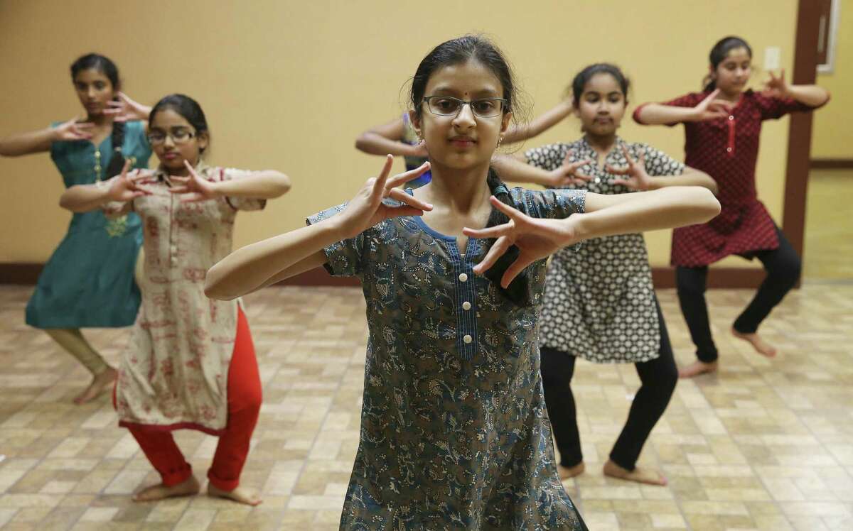 Nithya Chennupati and other students rehearse. Dance serves as both a pure physical and creative release and also a way to tell the myths, legends and other tales, including religious stories going back thousands of years or more.