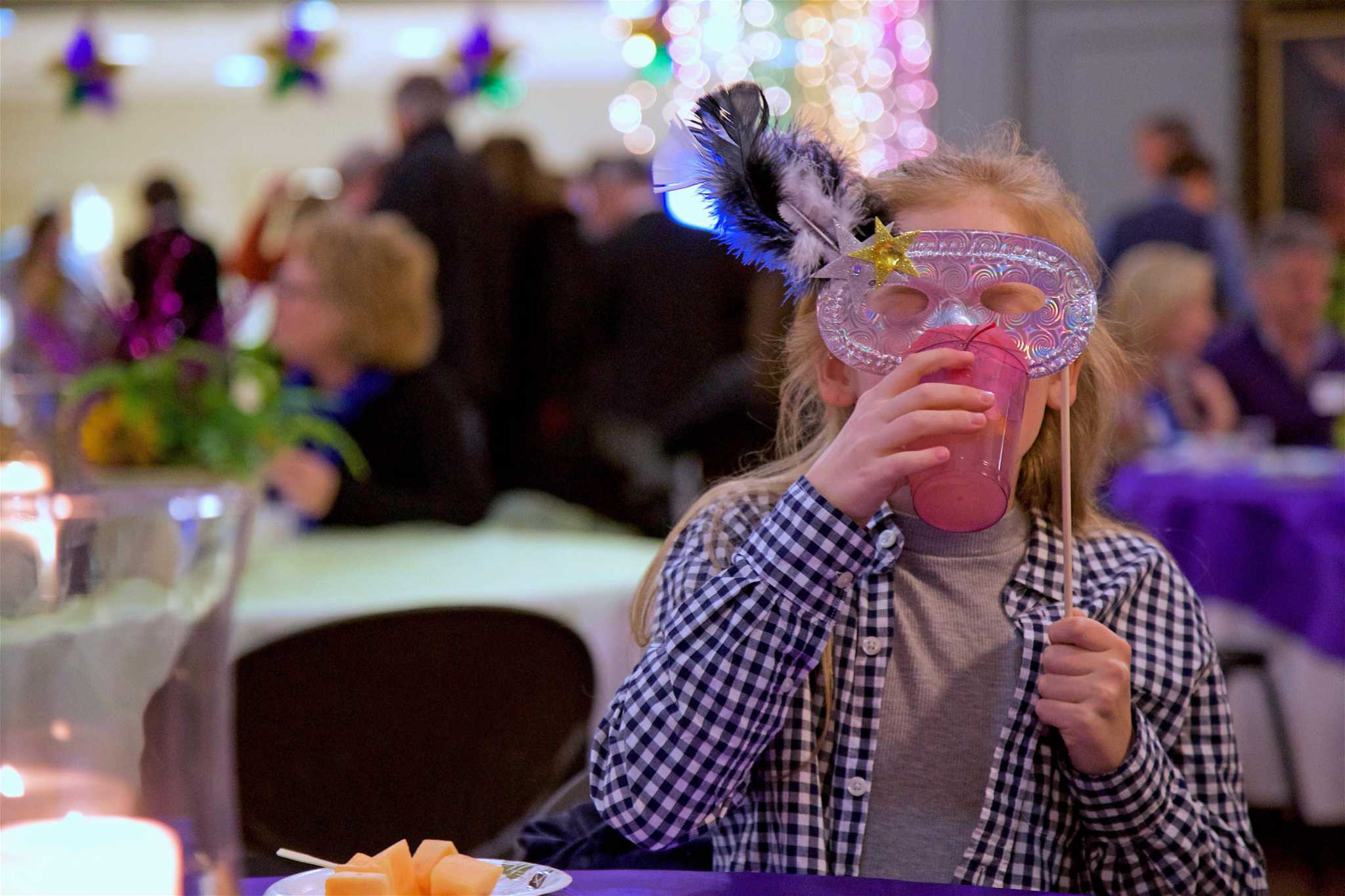 In Pictures / Mardi Gras party benefits youth ministry