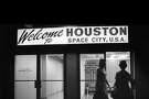 12/1967 - Flight attendants enter the international arrivals entrance at Hobby Airport. Arrivals are greeted with a "Welcome to HOUSTON SPACE CITY, U.S.A." sign over the door.
