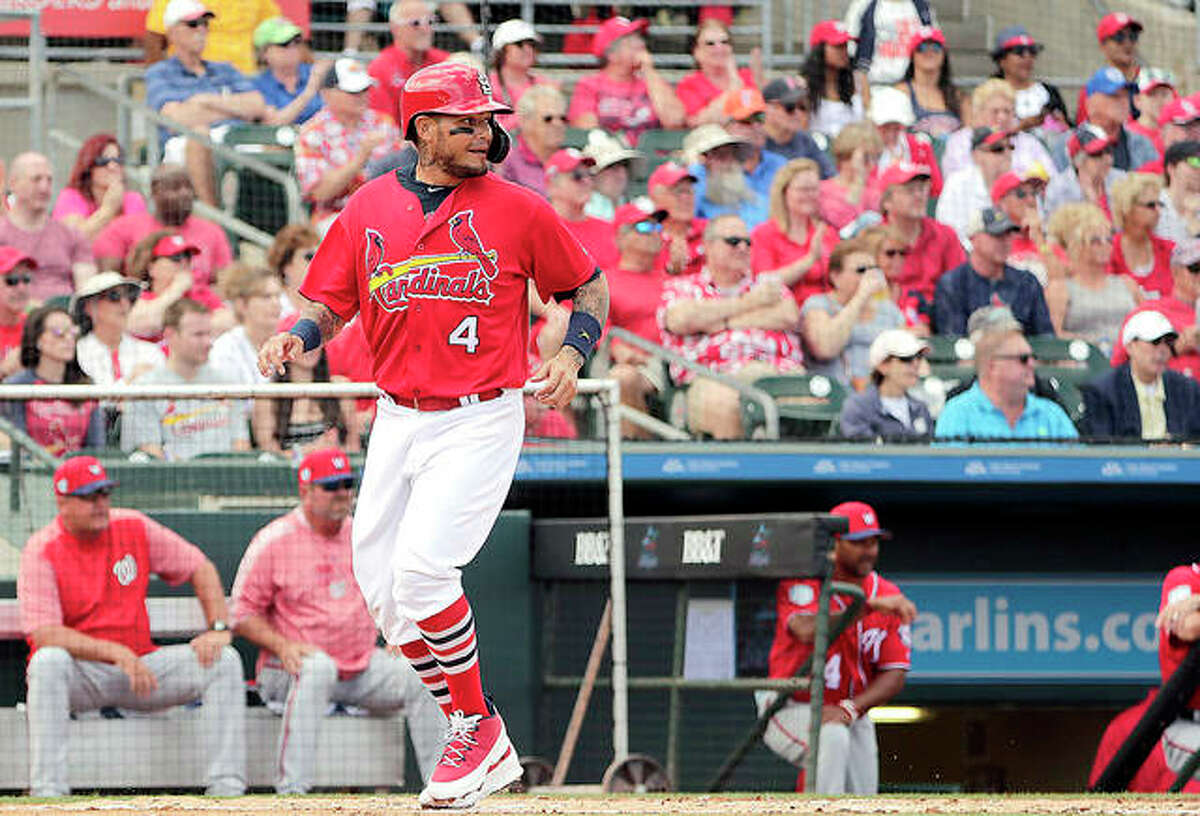 The Cardinals’ Yadier Molina (4) scores in the first inning during a spring training game against the Washington Nationals Friday in Jupiter, Fla.