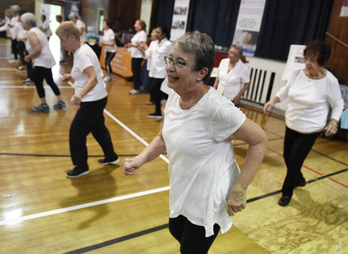 Byram resident Carole McCabe dances during a Zumba demonstration at the Health & Wellness Expo at the Eastern Greenwich Civic Center in Old Greenwich, Conn. Thursday, Oct. 11, 2018. The town is looking to build a new civic center building.