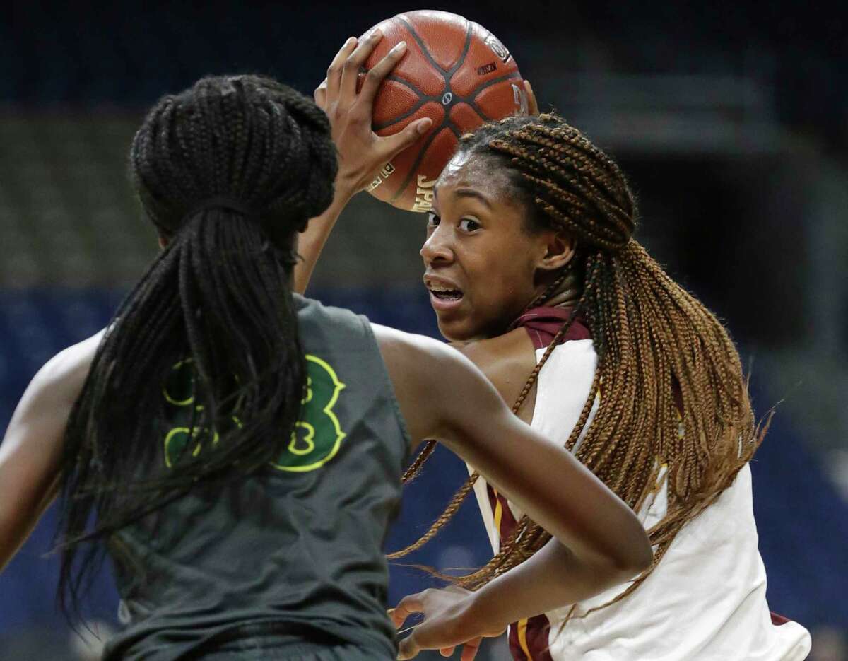 Lady Bulldog forward Maliyah Johnson looks into the lane from high post as Humble Summer Creek plays DeSoto in the semifinals of the girls Class 6A state basketball tournament at the Alamodome on March 1, 2019.