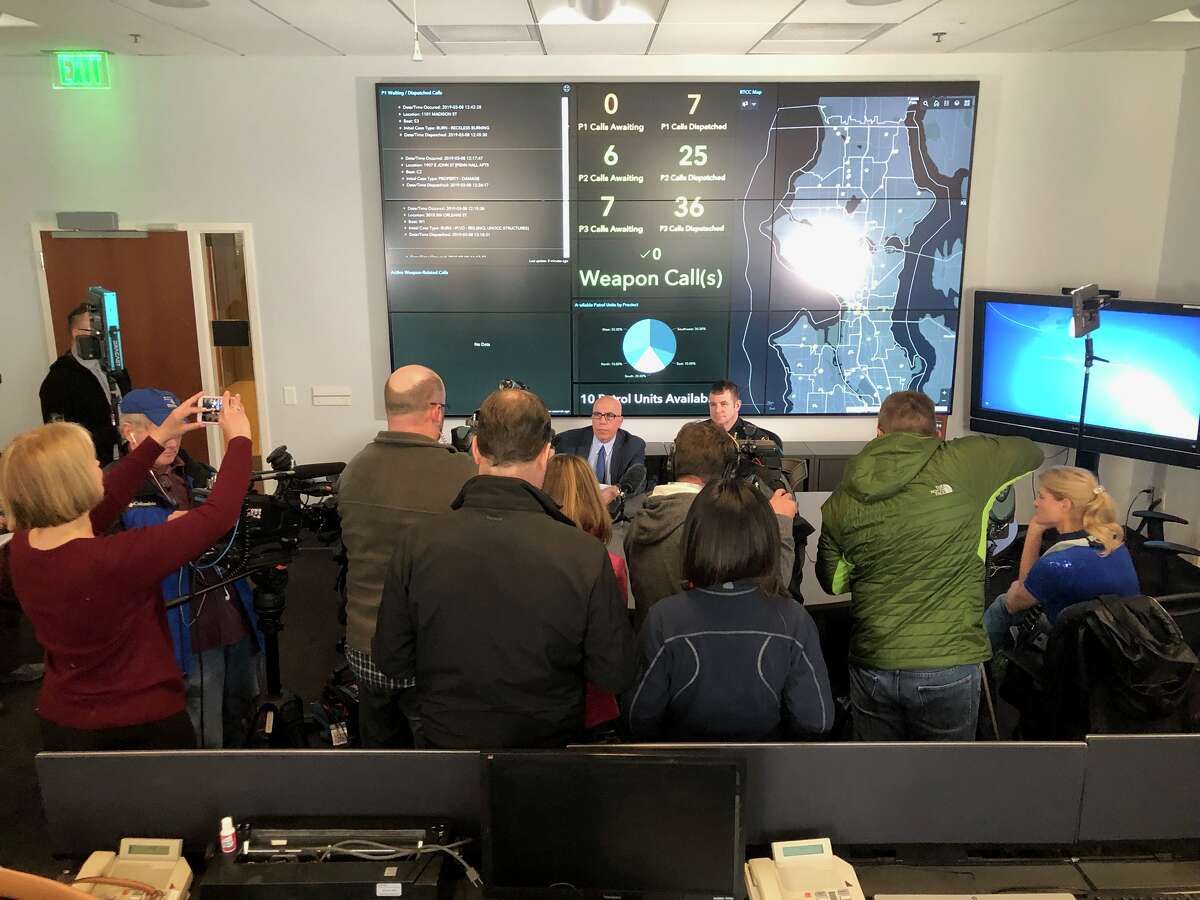 Capt. Mike Edwards and Deputy Chief Marc Garth Green brief reporters about an arrest made Feb. 28, 2019 of five people in connection with promoting prostitution in several illicit massage parlors and spas.