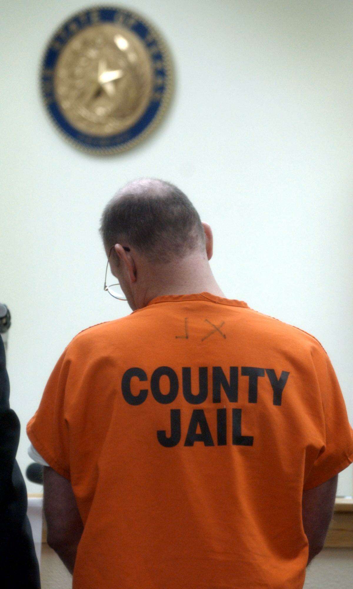 Richard McFarland, suspect in the death of his wife Susan McFarland, appears before Judge Sid Harle in 2002.