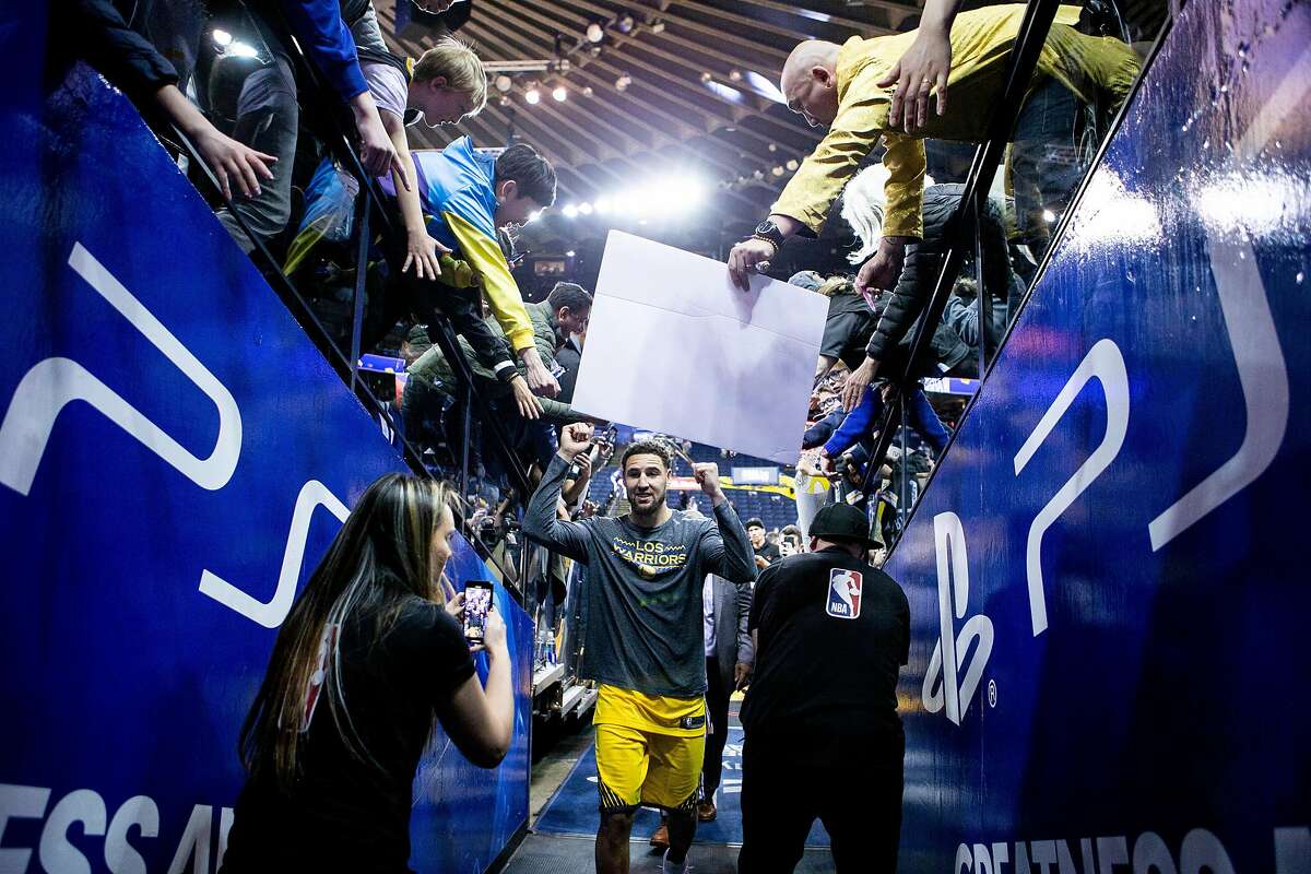 Golden State Warriors guard Klay Thompson (11) heads to the locker room following the Warriors' win against the Denver Nuggets in an NBA game at Oracle Arena on Friday, March 8, 2019, in Oakland, Calif.