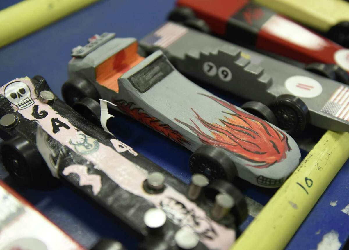 Adults to race Pinewood Derby cars at Miller Motorcars in Greenwich
