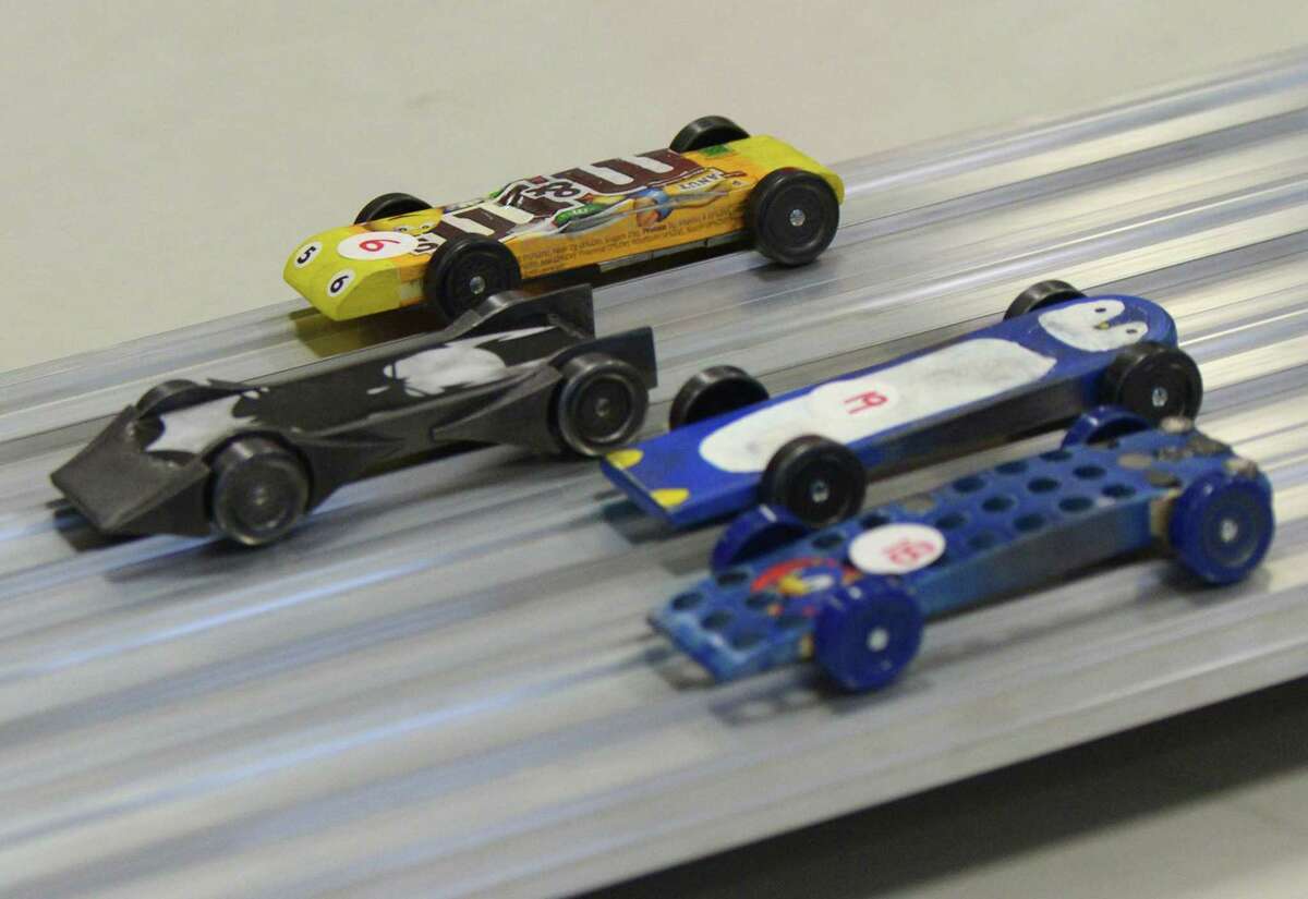 Adults to race Pinewood Derby cars at Miller Motorcars in Greenwich