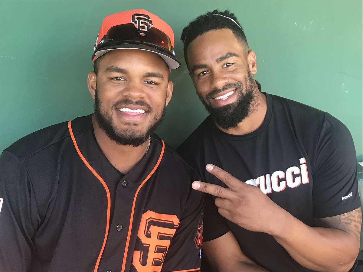 Brothers Heliot Ramos, left, and Henry Ramos are outfielders in the San Francisco Giants' organization.