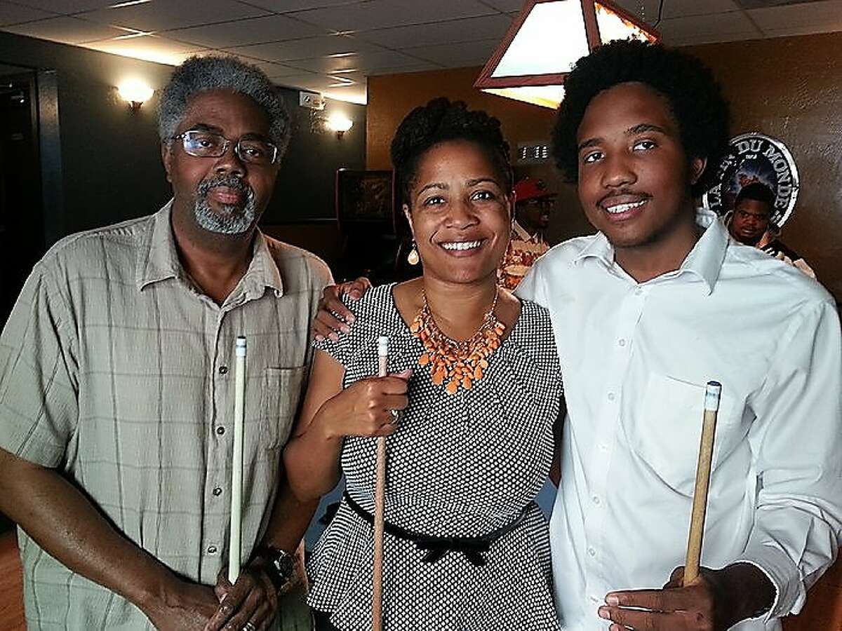 Victor McElhaney (right), who was shot and killed early Sunday, March 10, 2019, in the Los Angeles area, is shown celebrating his 21st birthday with his mom, Oakland City Council member Lynette McElhaney, and father, Clarence McElhaney, at Luca's Taproom in Oakland.