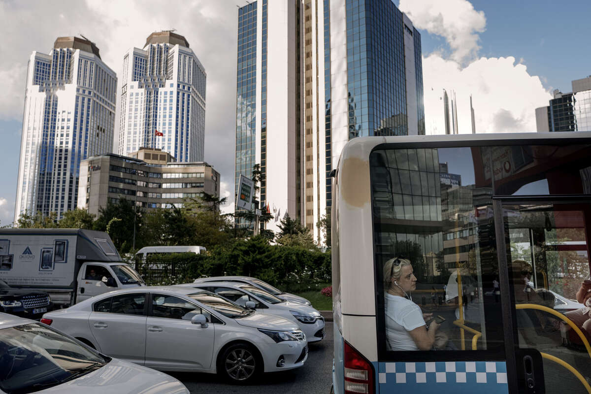 Traffic stands in line beneath skyscrapers in Istanbul on Aug. 10, 2018.