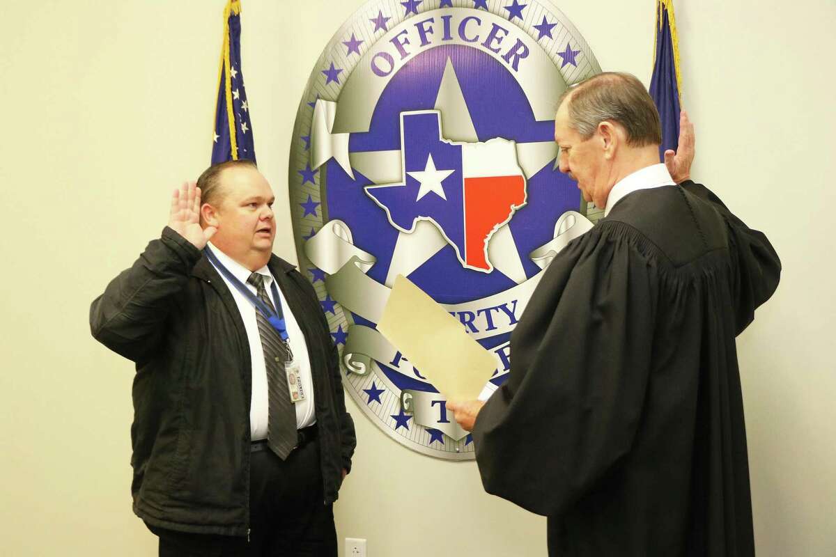 Gary Martin was sworn in as new police chief fulfilling a life-long dream and aspiration. He is sworn in by Liberty Municipal Court Judge Mike Little.