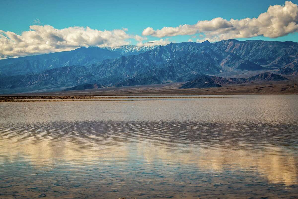 Rare 10milelong lake forms in Death Valley after heavy rains and flooding