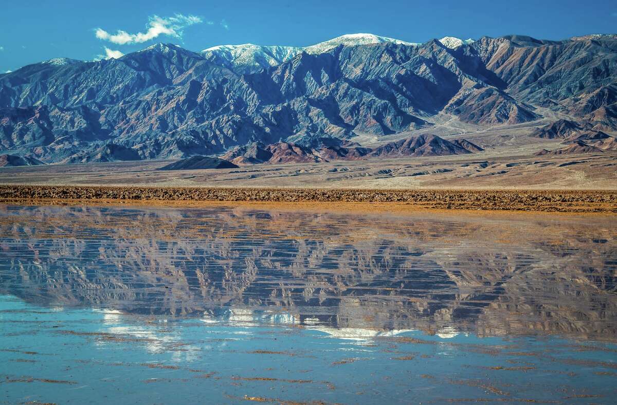 Rare 10milelong lake forms in Death Valley after heavy rains and flooding