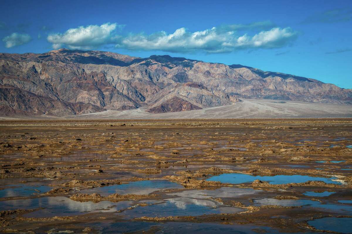 Rare 10milelong lake forms in Death Valley after heavy rains and flooding