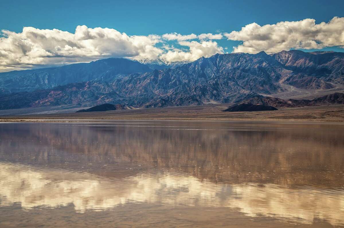 Rare 10milelong lake forms in Death Valley after heavy rains and flooding