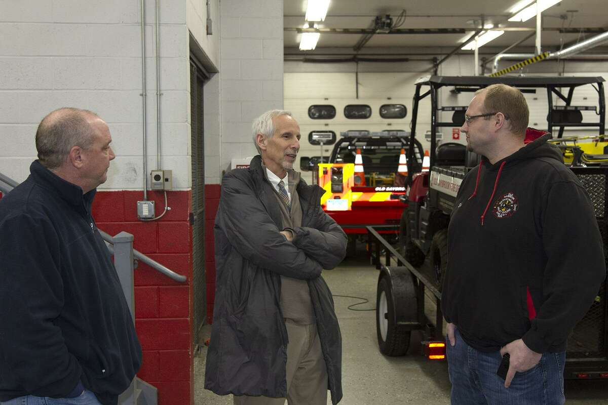 State Sen. Norm Needleman, center, speaks with Old Saybrook Fire Department Lt. Bill Decapua, left, and First Assistant Chief James Dion during a visit and tour of the fire department.
