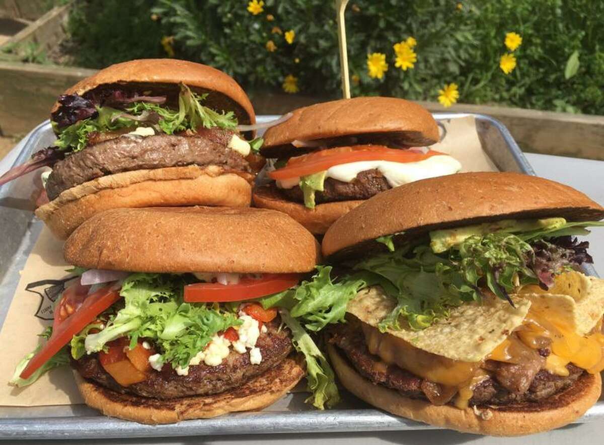 A lineup of burgers from the menu at The Cove