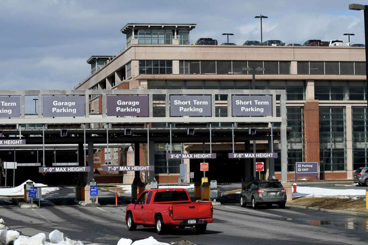 Workers complete airport parking garage structure