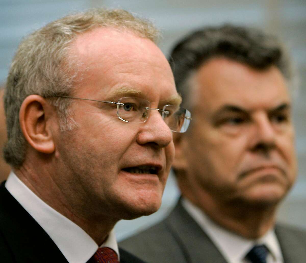 Sinn Fein's deputy leader and chief negotiator Martin McGuinness, center, comments to reporters and lawmakers about the Irish Republican Army's announcement that they will abandon their "armed campaign" and resume disarmament in a declaration designed to revive Northern Ireland's peace process, on Capitol Hill, in Washington, Thursday, July 28, 2005. McGuinness is joined at by Rep. Peter King, R-NY, at right. (AP Photo/J. Scott Applewhite)