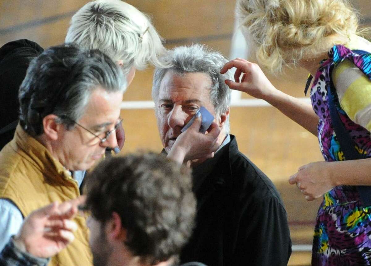 Makeup artists tend to actor Dustin Hoffman on the set of "The Boychoir," that was filming at the Greenwich Civic Center in Old Greenwich, Conn.,Tuesday afternoon, March 11, 2014.
